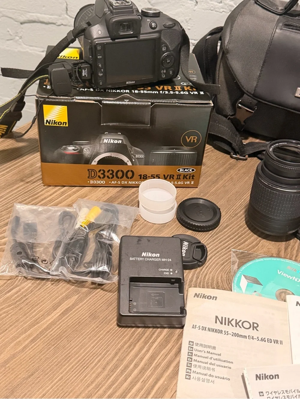 Nikon D3300 DSLR Bundle — 18-55mm + 55-200mm VR, WU-1a, Bag, Boxes — 4,627 Shots
